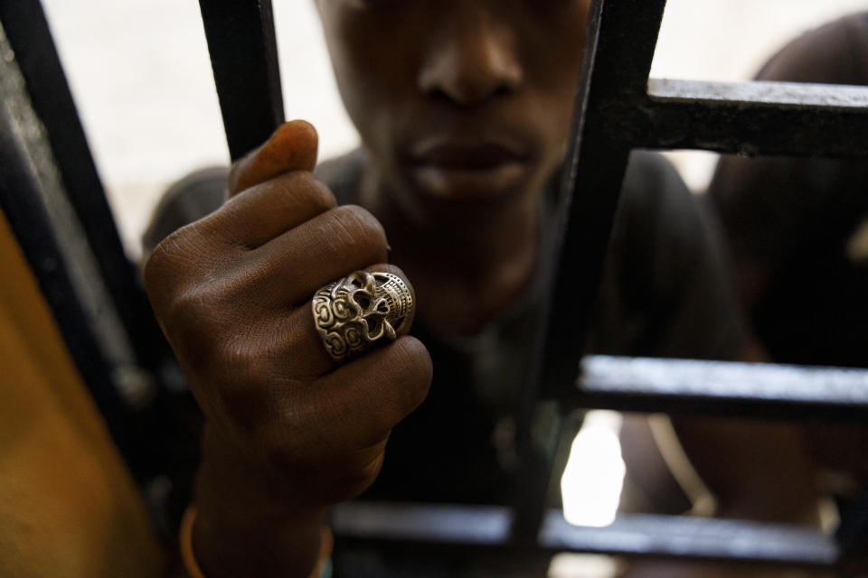 A Kush user waits outside during a medical outreach center of Sierra Leone's Youth Development and Child Link (SLYDCL), an NGO that provides medical care and psychological needs for drug users, Friday, April 26, 2024. Sierra Leone declared a war on the cheap synthetic drug, calling it an epidemic and a national threat. The drug is ravaging youth, and healthcare services are severely limited. (AP Photo/ Misper Apawu)