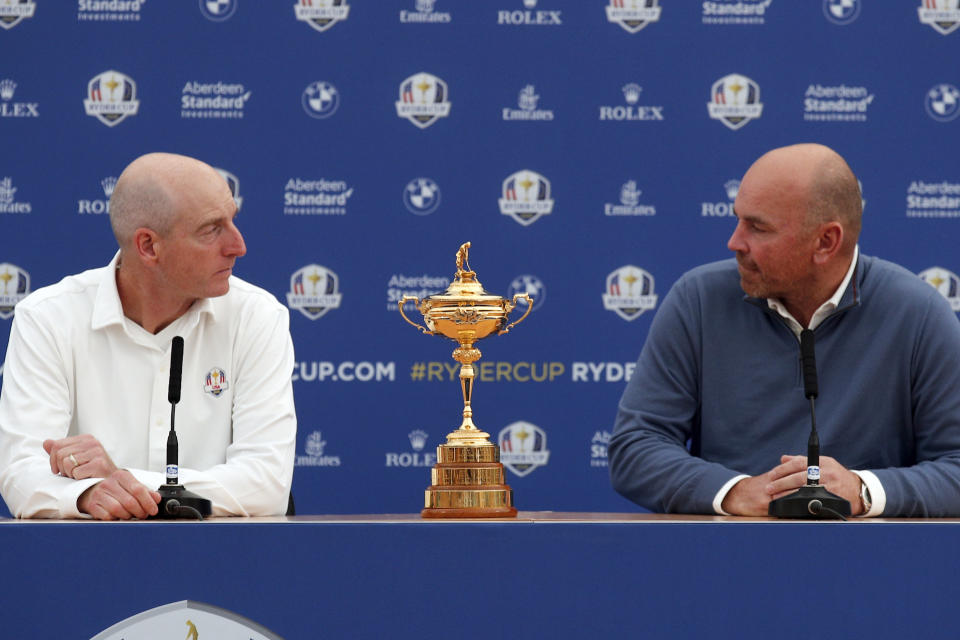 USA Captain Jim Furyk, left, and Europe Captain Thomas Bjorn look at each other during a news conference ahead of the Ryder Cup at the Golf National in Guyancourt, outside Paris, France, Monday, Sept. 24, 2018. The 42nd Ryder Cup Matches will be held in France from Sept. 28-30, 2018, at the Albatros Course of Le Golf National. (AP Photo/Francois Mori)