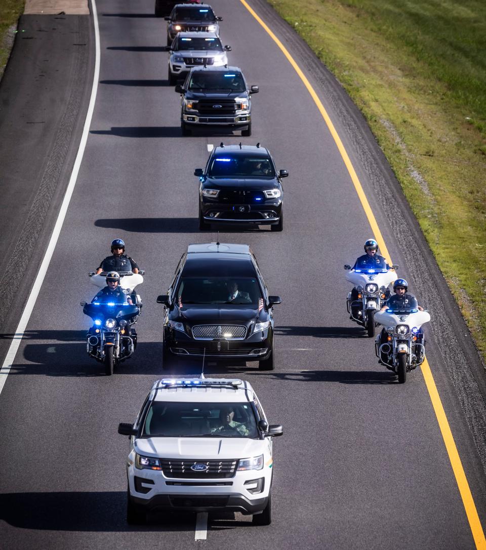 The funeral procession for Charlie Daniels is led by Mt. Juliet Police as it makes its way down 840 in Lebanon Friday, July 10, 2020.