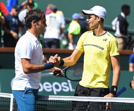 Mar 15, 2019; Indian Wells, CA, USA; Roger Federer (SUI) shakes hands with Hubert Hurkacz (POL) after winning his semi final in the BNP Paribas Open at the Indian Wells Tennis Garden. Mandatory Credit: Jayne Kamin-Oncea-USA TODAY Sports