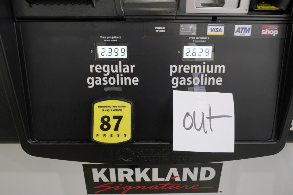 A note posted at a gas pump indicates the pump is out of premium gasoline at a Costco Warehouse fuel station, Tuesday, May 11, 2021, in Ridgeland, Miss. State officials warn that any shortages seen at individual gas stations are a result of people "panic buying," and not the Colonial Pipeline shutdown itself. They call on residents to limit unnecessary travel and to only buy as much gasoline as they need. (AP Photo/Rogelio V. Solis)