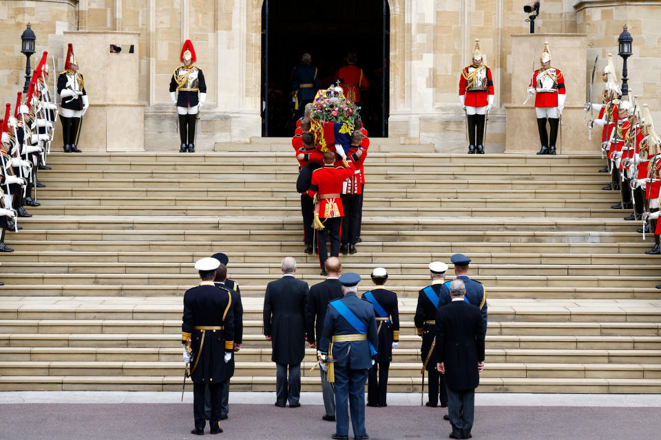 Pall bearers carry the coffin of Queen Elizabeth II with the Imperial State Crown resting on top into St. George's Chapel at Windsor Castle.<span class="copyright">Jeff J Mitchell—Getty Images</span>