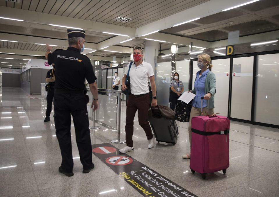 German tourists arrive at Son San Joan Aeroport  in Palma de Mallorca on June 15, 2020, as part of a pilot program a week before Spain reopens its borders. - Spain, one of the world's leading tourist destinations, will next June 21 re-establish free travel with fellow EU countries. (Photo by JAIME REINA / AFP) (Photo by JAIME REINA/AFP via Getty Images)