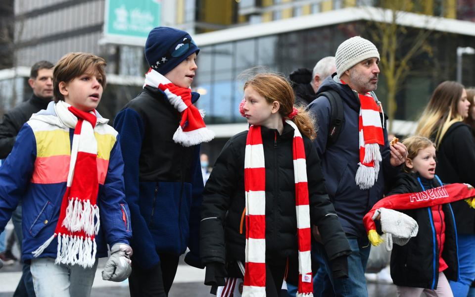 Arsenal fans arrive to Wembley Stadium ahead of the Vitality Women's FA Cup Final between Arsenal FC and Chelsea FC at Wembley Stadium on December 05, 2021 in London, England - GETTY IMAGES