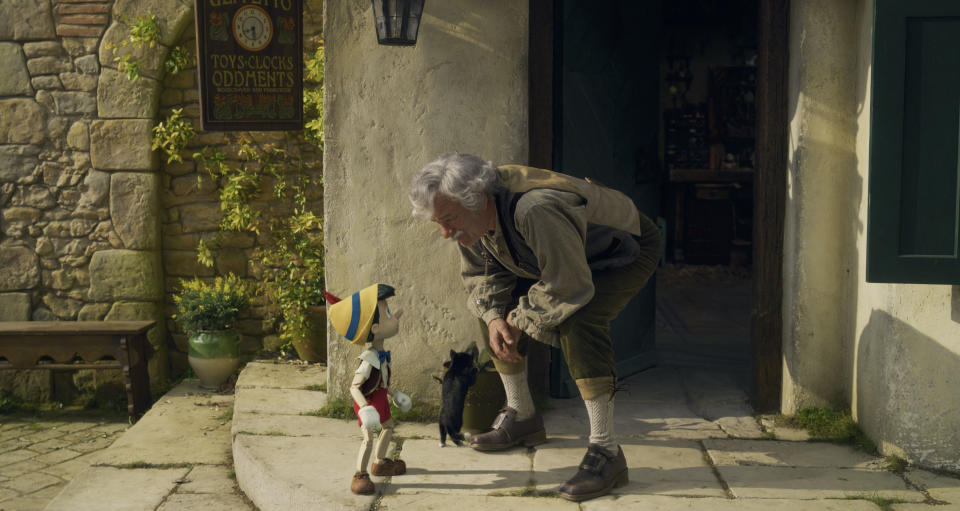 (L-R): Pinocchio (voiced by Benjamin Evan Ainsworth), Figaro, and Tom Hanks as Geppetto in Disney's live-action PINOCCHIO, exclusively on Disney+. Photo courtesy of Disney Enterprises, Inc. Â© 2022 Disney Enterprises, Inc. All Rights Reserved.