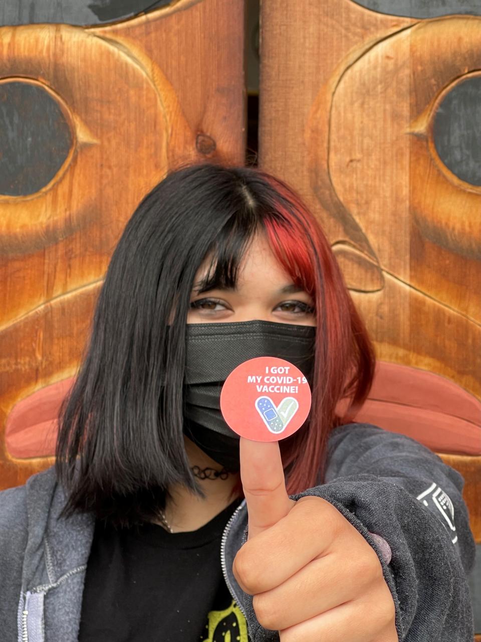 Mikayla Madayag of Suquamish shows off her “I got my COVID-19 Vaccine” sticker shortly after getting her first Pfizer shot at a youth vaccination clinic hosted Monday by the Port Gamble S’Klallam Tribe and Suquamish Tribe. The tribes administered 136 shots in total.