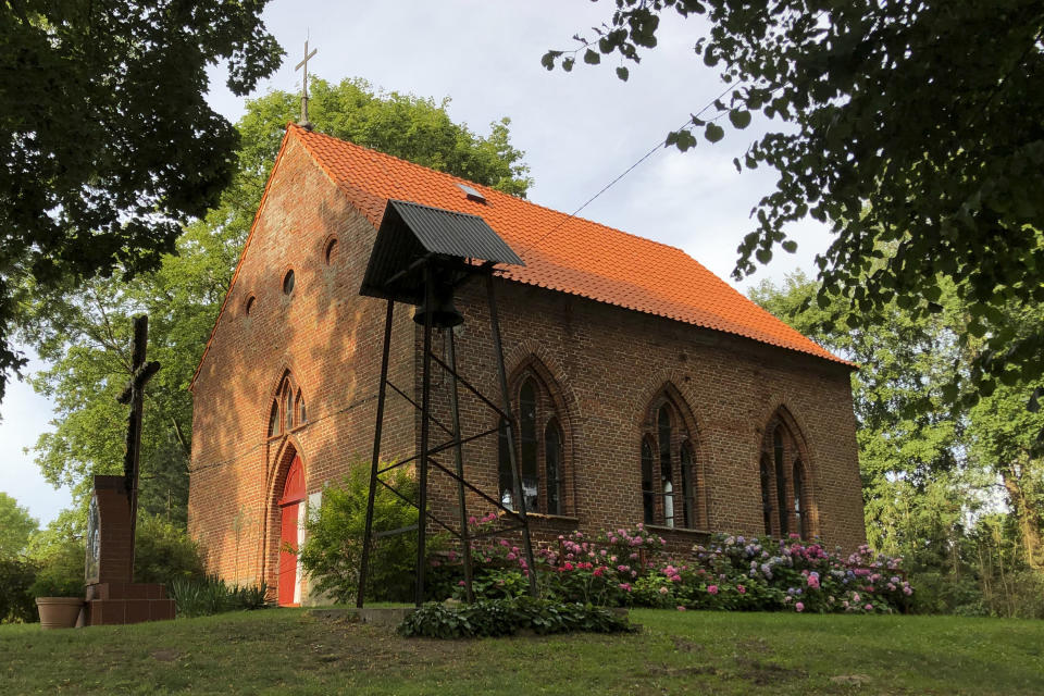 The Roman Catholic church where it is believed that Danish King Harald Gormsson was buried, in Wiejkowo, Poland, Saturday, July 30, 2022. More than 1,000 years after his death in what is now Poland, a Danish king whose nickname is known to the world through the Bluetooth technology is at the center of an archeological dispute. A Polish researcher and a Swedish archeologist claim that they have pinpointed the probable burial site for King Harald Bluetooth Gormsson in a small village in northwestern Poland, an area that once had ties with the Vikings. (AP Photo Monika Scislowska)