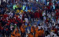 Athletes dance in the arena following the closing ceremony for the 2014 Sochi Winter Olympics, February 23, 2014. REUTERS/Issei Kato (RUSSIA - Tags: OLYMPICS SPORT)