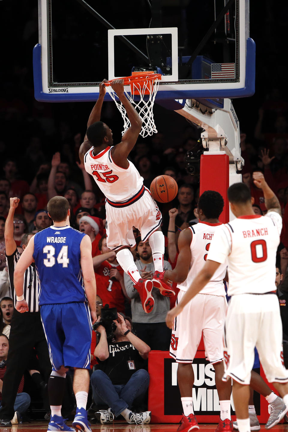 St. John's Sir'Dominic Pointer (15) dunks against Creighton during the first half of an NCAA college basketball game, Sunday, Feb. 9, 2014, in New York. (AP Photo/Jason DeCrow)