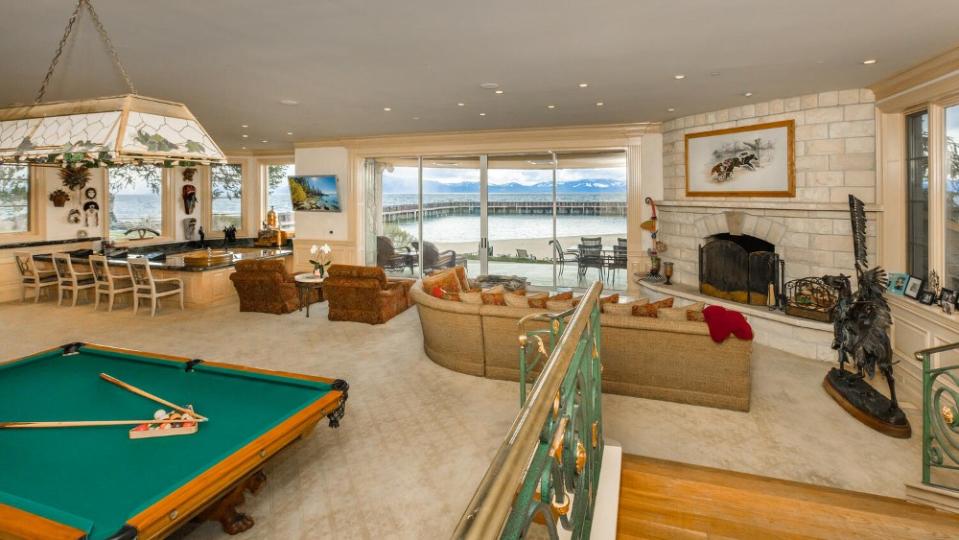 The entertainment room features a billiards table and opens directly onto the lake. - Credit: Scott Thompson