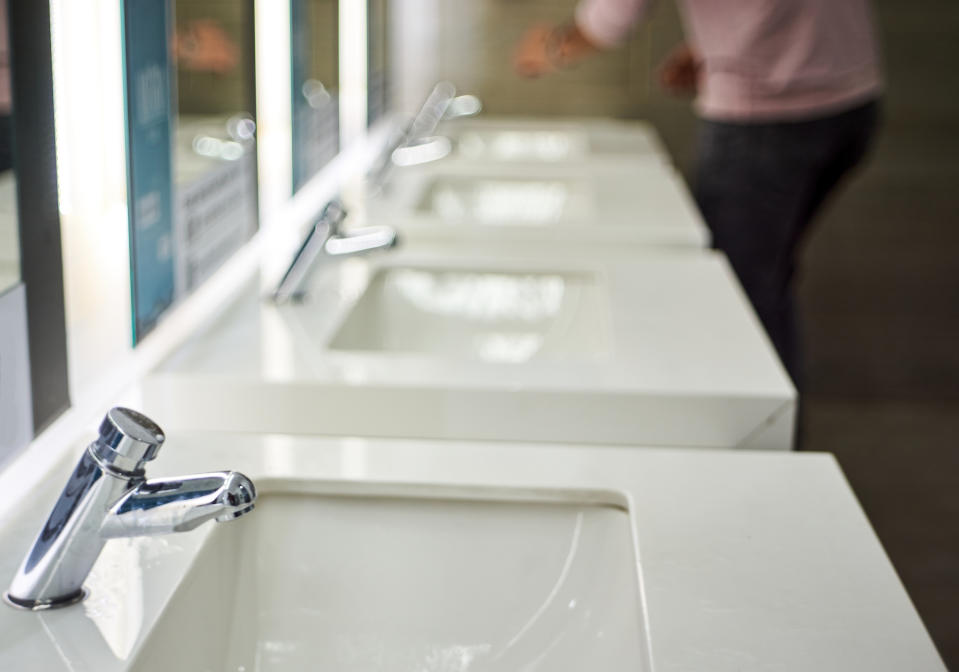 row of sinks at the airport