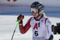 Austria's Cornelia Huetter celebrates at the finish area of an alpine ski, women's World Championships super G, in Meribel, France, Wednesday, Feb. 8, 2023. (AP Photo/Marco Trovati)