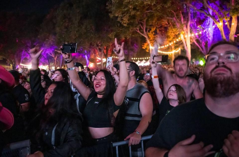 Val Miranda, center, rocks out next to her sister, Emy Miranda, both of Reno, as Avenged Sevenfold performs on the first day of Aftershock music festival on Thursday at Discovery Park in Sacramento. The festival, launched in 2012 and is now one of the nation’s leading rock festivals.