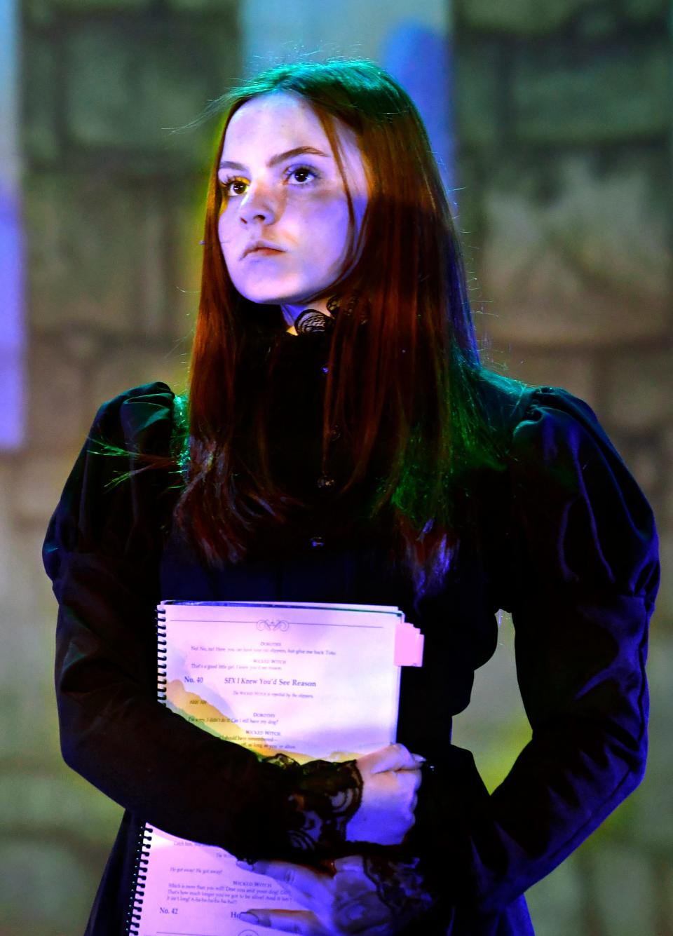 Kerrigan Wright, who plays the  Wicked Witch of the East, listens to director Neena McLain during Tuesday's rehearsal.