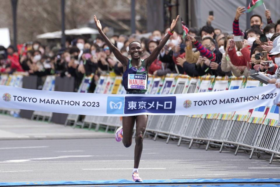 Rosemary Wanjiru of Kenya crosses the finish line, winning the women's race of Tokyo Marathon, Sunday, March 5, 2023, in Tokyo, Japan.(Zhang Xiaoyu/Pool Photo via AP)