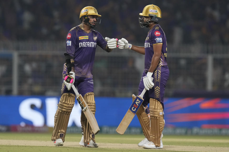 Kolkata Knight Riders' Sunil Narine and captain Shreyas Iyer give fist touch after scoring runs during the Indian Premier League cricket match between Kolkata Knight Riders and Rajasthan Royals in Kolkata, India, Tuesday, April 16, 2024. (AP Photo/Bikas Das)