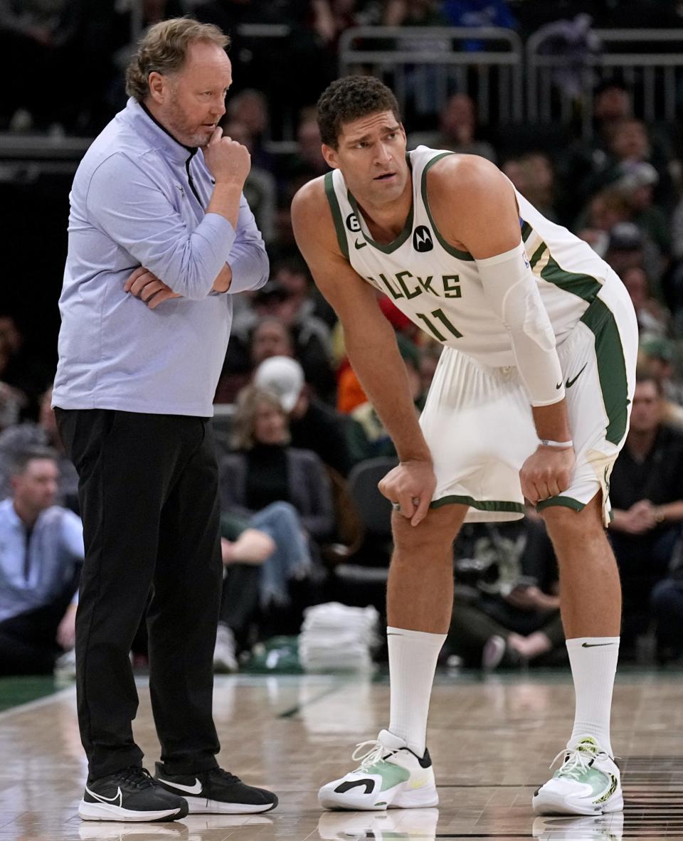 Milwaukee Bucks center Brook Lopez (11) listens to head coach Mike Budenholzer during the second half of their game Sunday, November 27, 2022 at Fiserv Forum in Milwaukee, Wis. The Milwaukee Bucks beat the Dallas Mavericks 124-115.