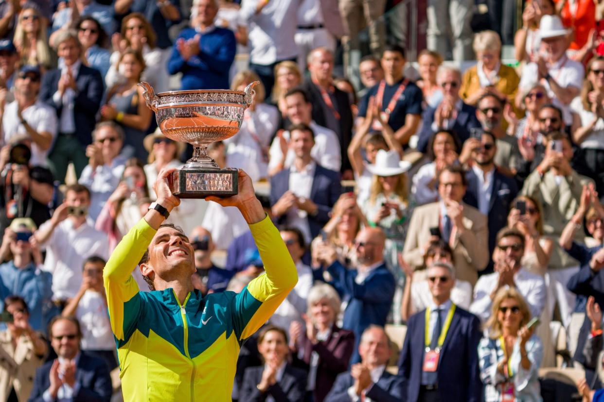 PARIS, FRANCE - JUNE 05: Rafael Nadal of Spain poses with the Musketeers’ Cup after winning Championship point against Casper Ruud of Norway during the Men's Singles Final match on Day 15 of The 2022 French Open at Roland Garros on June 05, 2022 in Paris, France. (Photo by Andy Cheung/Getty Images)