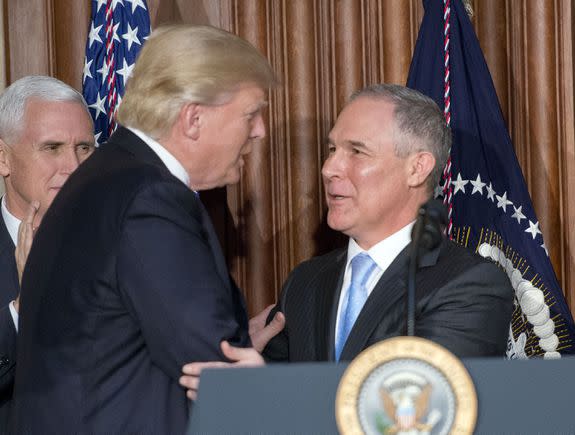 President Donald Trump, left, with Scott Pruitt, before signing an executive order to unravel Obama-era climate policies.