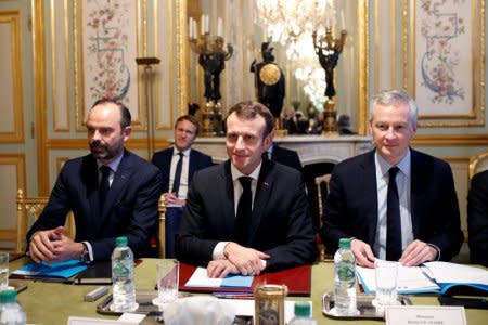 France's President Emmanuel Macron, France's Prime Minister Edouard Philippe and France's Finance Minister Bruno Le Maire attend a meeting with the representatives of the banking sector at the Elysee Palace in Paris, France, December 11, 2018. Thibault Camus/Pool via REUTERS