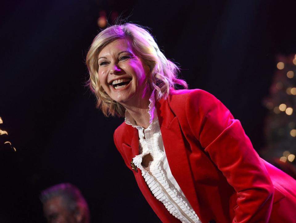 Olivia Newton-John performs at the Hollywood Christmas parade in 2016 (AFP via Getty Images)