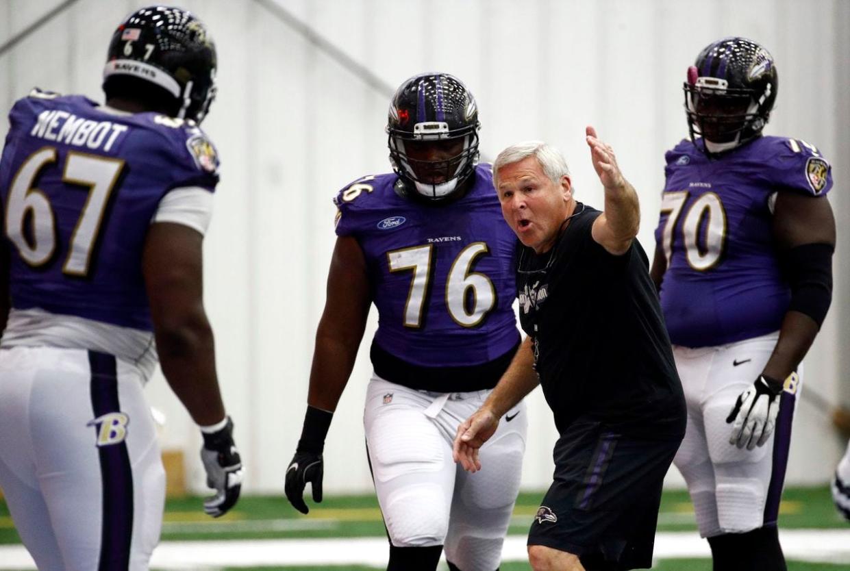 Baltimore Ravens offensive line coach Joe D'Alessandris instructs his players during a recent Ravens practice.