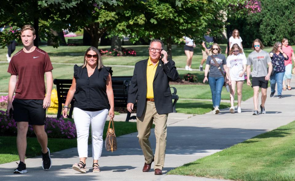 Christopher Smith, left, and his mother, Debra, and father, J.R., all of Saline, were among the 1,200 visitors who toured Adrian College's campus July 15 during Sneak Peek day.