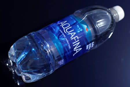 A bottle of Aquafina drinking water is shown in this photo illustration