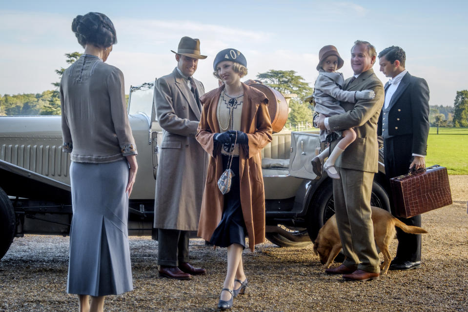 This image released by Focus features shows Elizabeth McGovern, from left, Harry Hadden-Paton, Laura Carmichael, Hugh Bonneville and Michael Fox, right, in a scene from "Downton Abbey," in theaters on Sept. 20. (Jaap Buitendijk/Focus Features via AP)