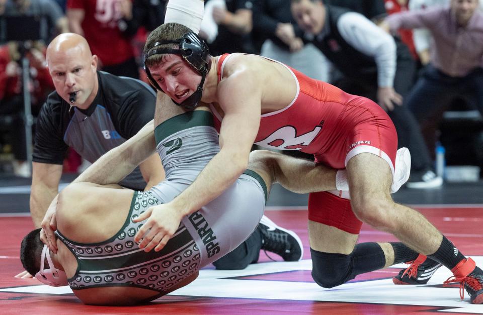 Rutgers' Joey Olivieri (right) locks in a cradle and puts Michigan State's Jordan Hamdan to his back in the 141-pound bout Friday night. Olivieri scored a 16-4 win by major decision. Rutgers won the match 16-15.