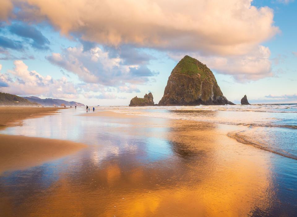 <p>Head to Cannon Beach in Oregon at golden hour (just before sunrise) to see Haystack Rock in its best light. </p>
