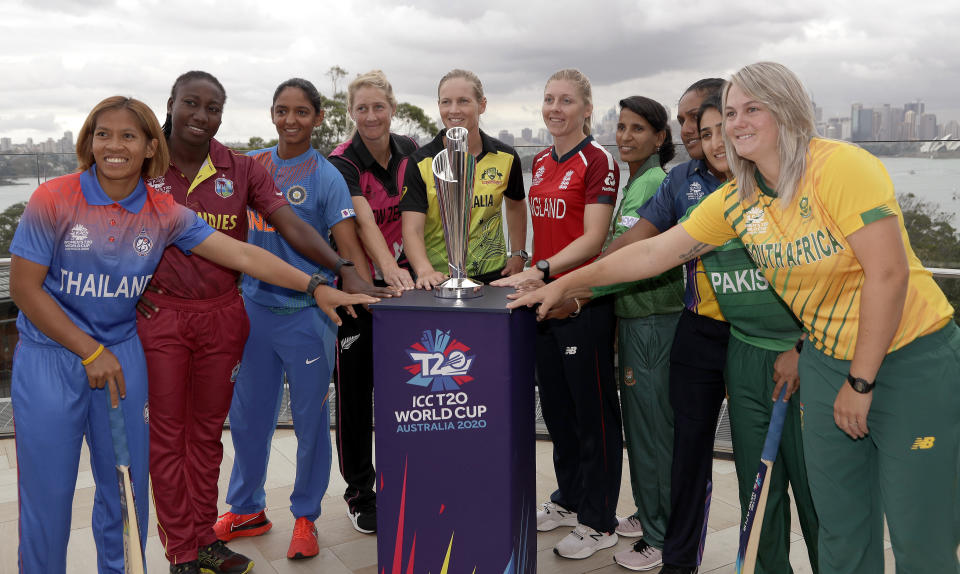 The captains of the 10 countries participating in the Women's T20 World Cup pose fore a photo with the trophy in Sydney, Monday, Feb. 17, 2020. The tournament begins Friday, Feb. 21. From left to right are, Sornnarin Tippoch of Thailand, Stafanie Taylor of West Indies, Harmanpreet Kaur of India, Sophie Devine, of New Zealand, Meg Lanning of Australia, Heather Knight of England, Salma Khatun of Bangladesh. Chamari Atapattu of Sri Lanka, Bismah Maroof of Pakistan and Dane van Niekerk of South Africa. (AP Photo/Rick Rycroft)