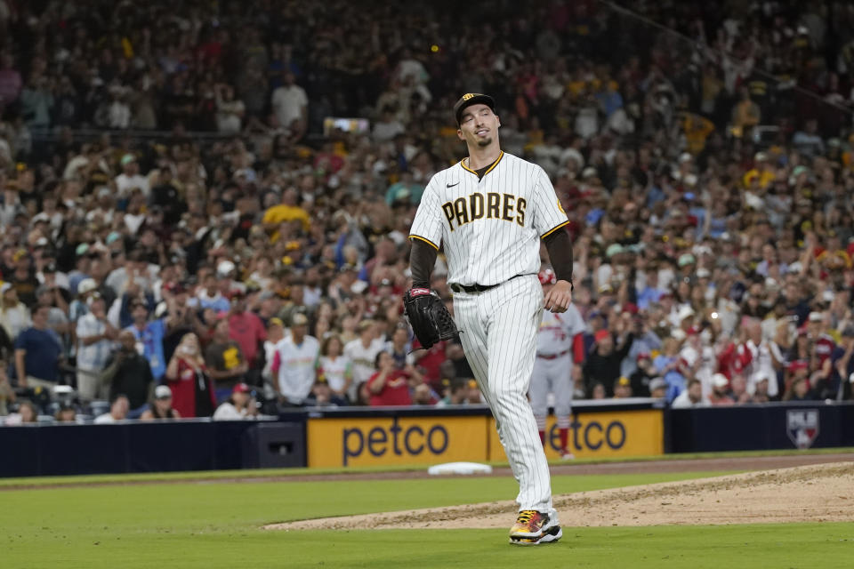 San Diego Padres starting pitcher Blake Snell reacts after giving up his first hit of the night, a single by St. Louis Cardinals' Albert Pujols during the seventh inning of a baseball game Wednesday, Sept. 21, 2022, in San Diego. (AP Photo/Gregory Bull)