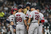 Boston Red Sox pitching coach Dave Bush (58) talks with starting pitcher Michael Wacha, center, during the third inning of the team's baseball game against the Chicago White Sox on Thursday, May 26, 2022, in Chicago. (AP Photo/Charles Rex Arbogast)