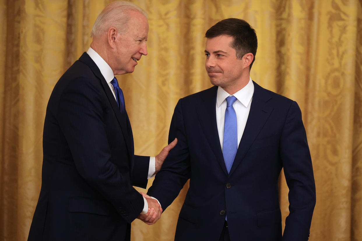 WASHINGTON, DC - JUNE 25: U.S. President Joe Biden (L) shakes hands with Transportation Secretary Pete Buttigieg during an event commemorating LGBTQ+ Pride Month at the White House on June 25, 2021 in Washington, DC. Buttigieg is the first openly gay White House cabinet member in U.S. history. (Photo by Chip Somodevilla/Getty Images)