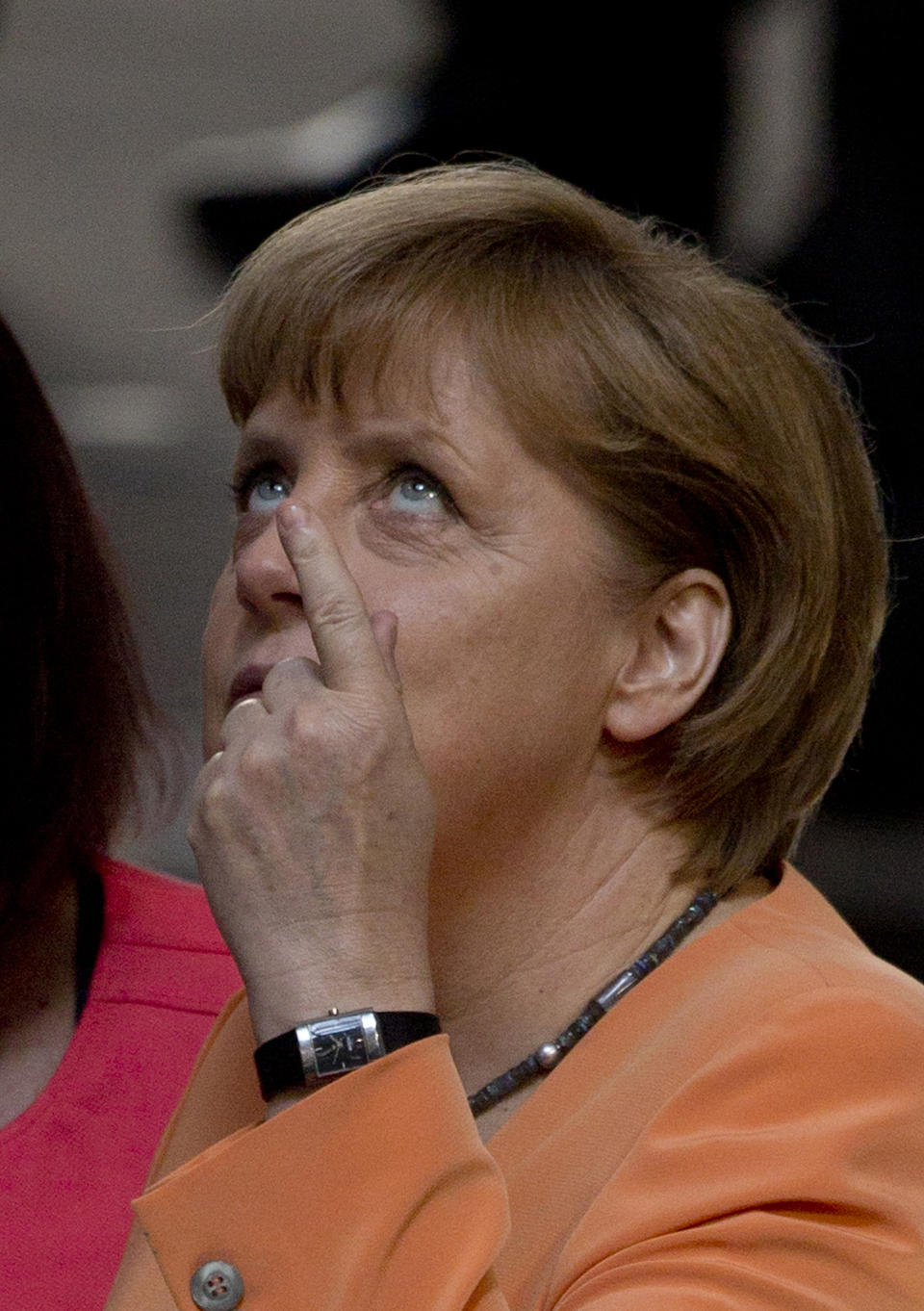 German Chancellor Angela Merkel gestures before a special session of the Germany Parliament Bundestag in Berlin, Germany, Thursday, July 19, 2012. Germany's Parliament is interrupting its summer break to vote on a rescue package worth up to euro 100 billion (US dollar 122 billion) for Spain's ailing banks. (AP Photo/Gero Breloer)