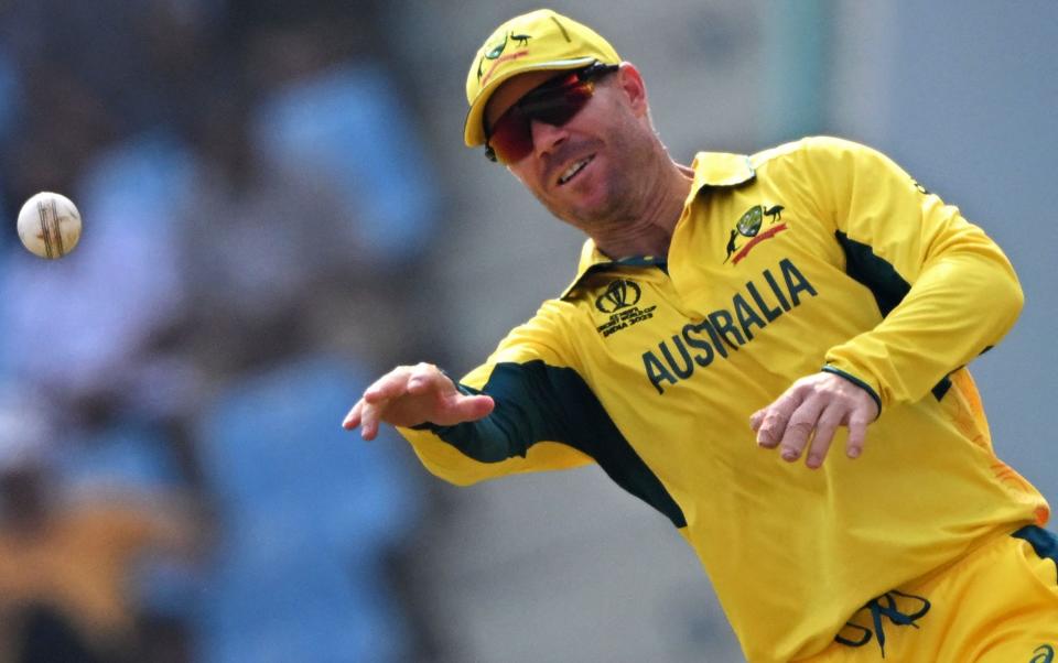 Australia's David Warner throws the ball