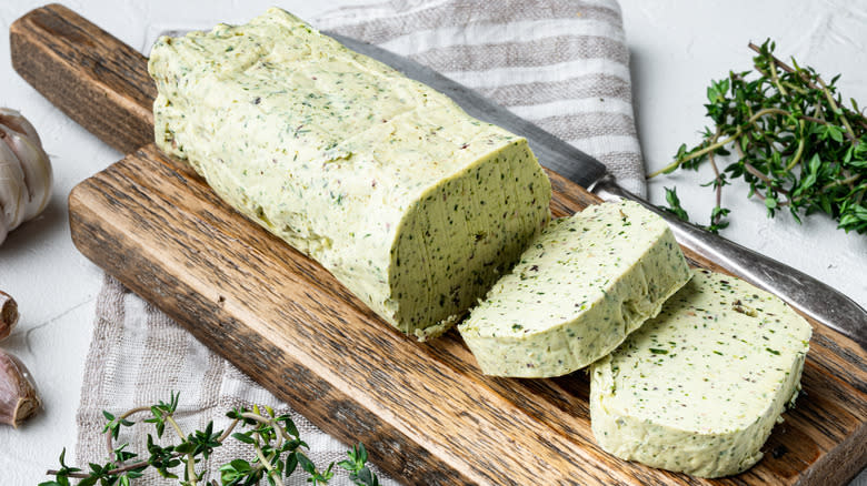 Herbed compound butter on a wooden board