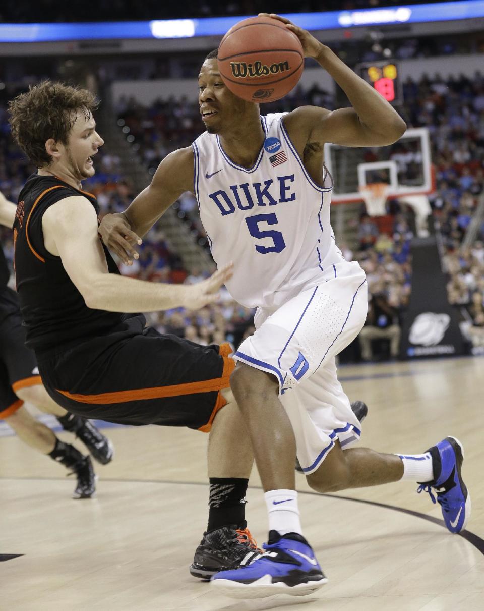 Duke forward Rodney Hood (5) runs into Mercer forward Bud Thomas (5) during the first half of an NCAA college basketball second-round game, Friday, March 21, 2014, in Raleigh, N.C. (AP Photo/Gerry Broome)