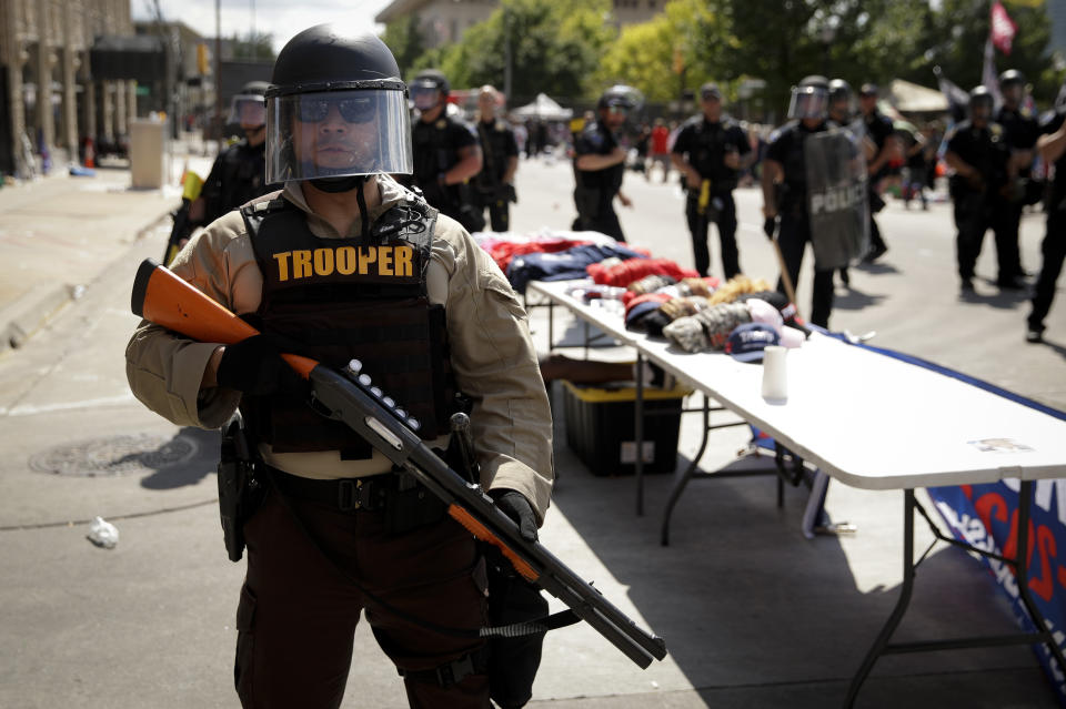 A trooper stands outside the BOK Center where President Trump will hold a campaign rally in Tulsa, Okla., Saturday, June 20, 2020. (AP Photo/Charlie Riedel)