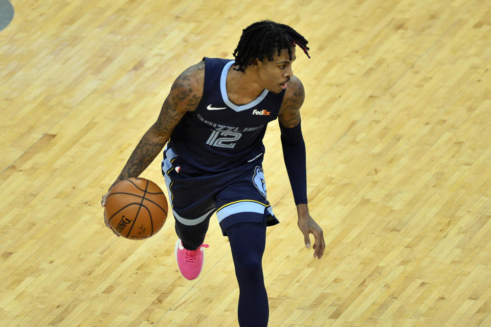 Memphis Grizzlies guard Ja Morant handles the ball in the first half of an NBA basketball game against the Atlanta Hawks Saturday, Dec. 26, 2020, in Memphis, Tenn. (AP Photo/Brandon Dill)