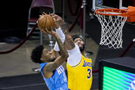 Houston Rockets center Christian Wood (35) tries to shoot around Los Angeles Lakers forward Anthony Davis (3) during an NBA basketball game Tuesday, Jan. 12, 2021, in Houston. (Mark Mulligan/Houston Chronicle via AP)