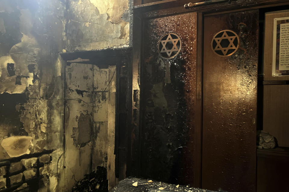 A view of the synagogue where a man armed with a knife and a metal bar is suspected of having set fire, Friday, May 17, 2024 in Rouen, France. French police have shot and killed a man armed with a knife and a metal bar who is suspected of having set fire to a synagogue in the Normandy city of Rouen. French police said officers were alerted early Friday morning that smoke was rising from the synagogue and came face to face with the man when they got there.(AP Photo/Oleg Cetinic)