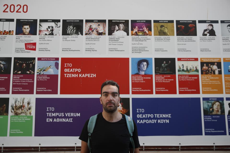 Actor and theater director Aris Laskos poses outside the Theater of Neos Kosmos in Athens, Thursday, Oct. 1, 2020. Laskos based in Athens, hasn't worked since early February and received a one-off support check for 800 euros ($940) shortly after the country's economy was placed in lockdown in the spring due to the pandemic. (AP Photo/Thanassis Stavrakis)