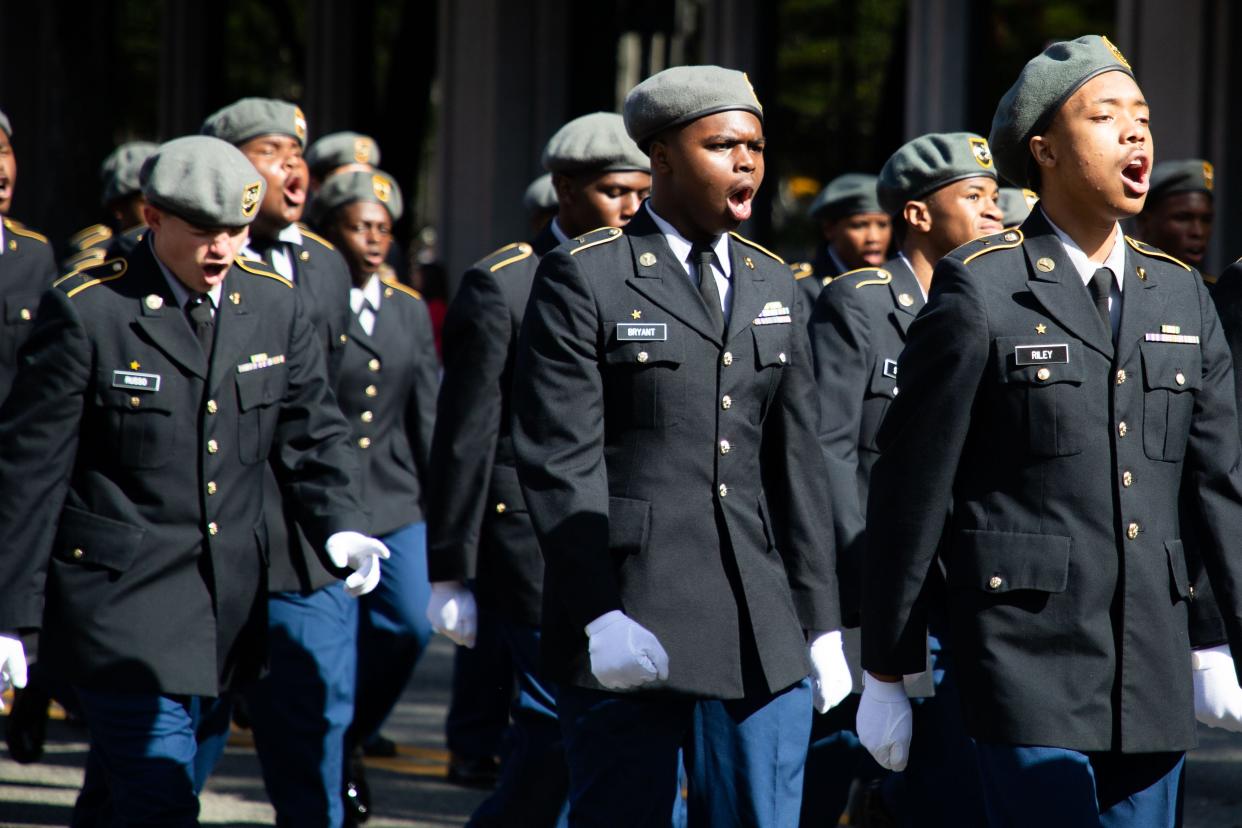 Participants in the annual Veterans Day Parade make their way down Monroe street as they honor and celebrate those who have served in the U.S. armed forces on Friday, Nov. 10, 2023.