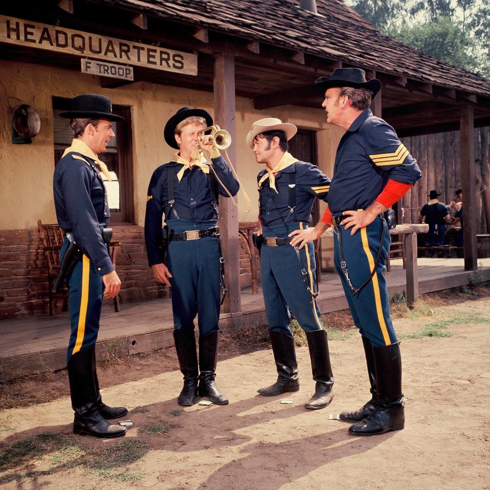 UNITED STATES - SEPTEMBER 08: F TROOP - "The Singing Mountie" - Season Two - 9/8/66, A mountie (guest star Paul Lynde as Sgt. Ramsden, left) arrived at Fort Courage to question Parmenter (Ken Berry), Agarn (Larry Storch, second from right) and O'Rourke (Forrest Tucker) about the whereabouts of Agarn's look-alike French-Canadian cousin.