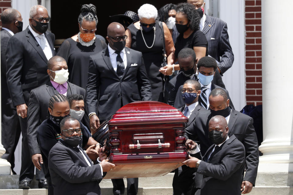 The casket containing the remains Rev. C.T. Vivian are carried from Providence Missionary Baptist Church after a funeral service Thursday, July 23, 2020, in Atlanta. Vivian, an early and key adviser to the Rev. Martin Luther King Jr., died Friday at the age of 95.(AP Photo/John Bazemore)