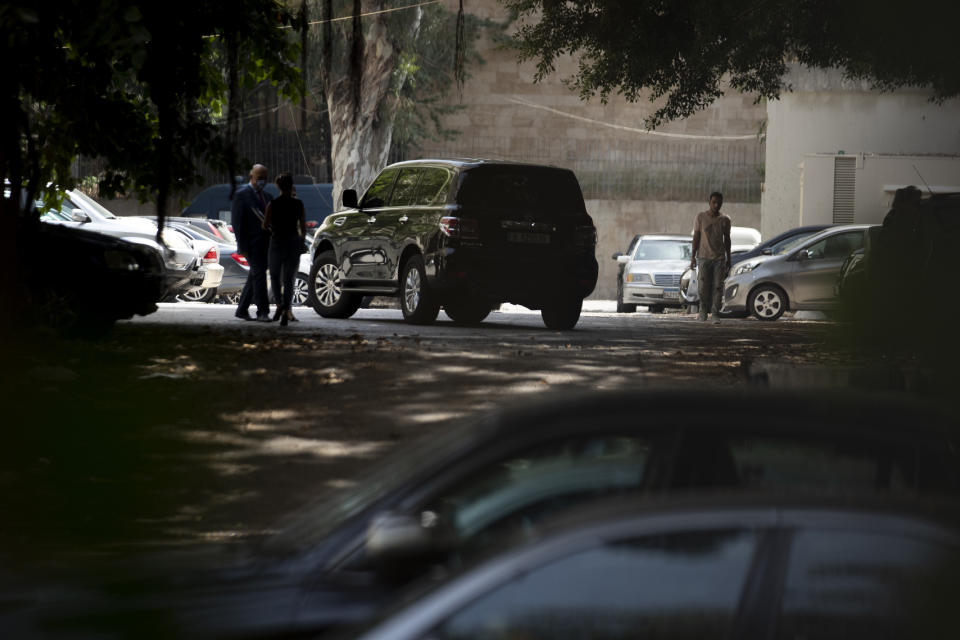 One of Carlos Ghosn's vehicles leaves the Justice Palace in Beirut, Lebanon, Monday, May 31, 2021. A team of French investigators began questioning ex-Nissan boss Carlos Ghosn in Beirut on Monday over suspicions of financial misconduct, Lebanese judicial officials said. (AP Photo/Hassan Ammar)