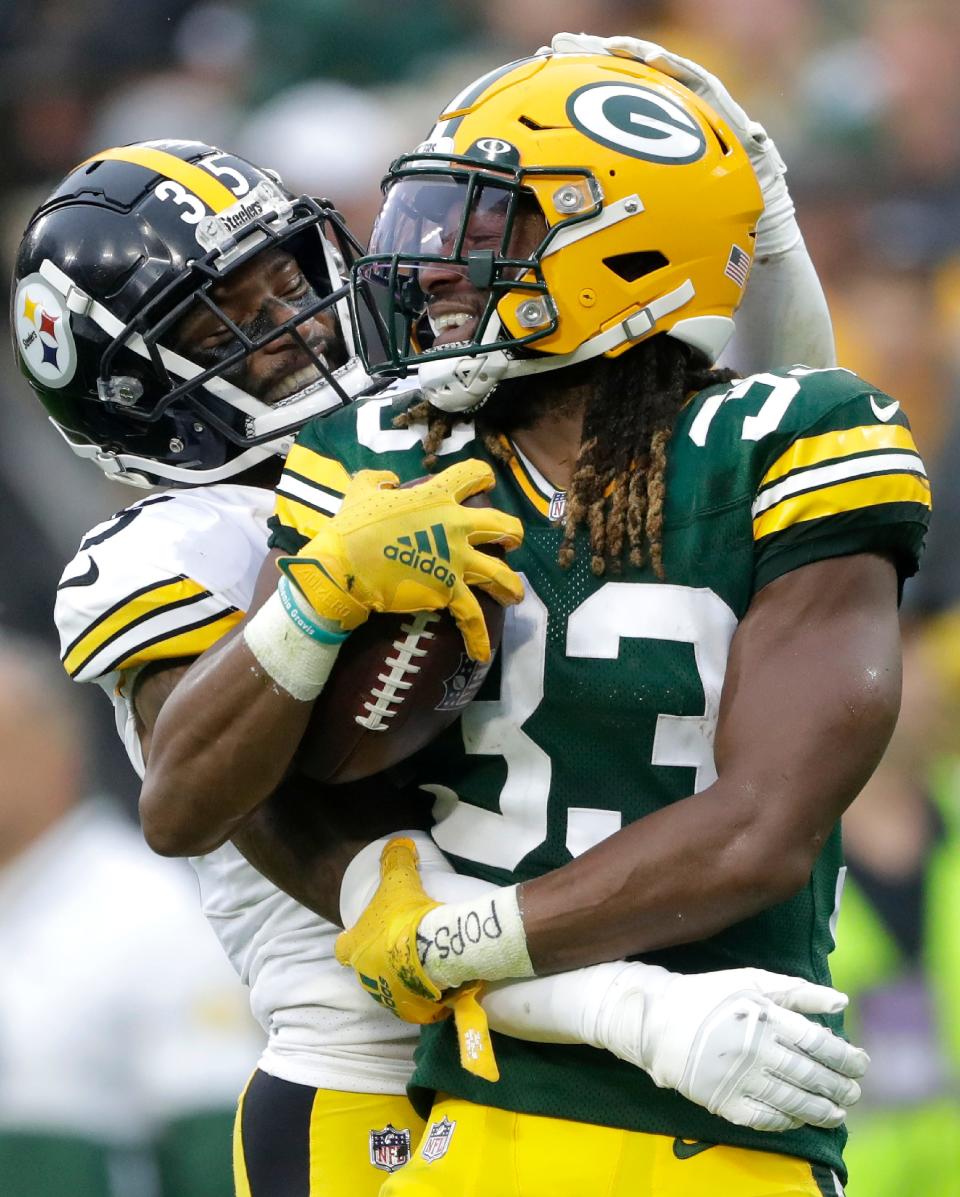 Green Bay Packers running back Aaron Jones (33) and Pittsburgh Steelers cornerback Arthur Maulet (35) during their football game on Sunday, October 3, 2021, at Lambeau Field in Green Bay, Wis. Wm. Glasheen USA TODAY NETWORK-Wisconsin