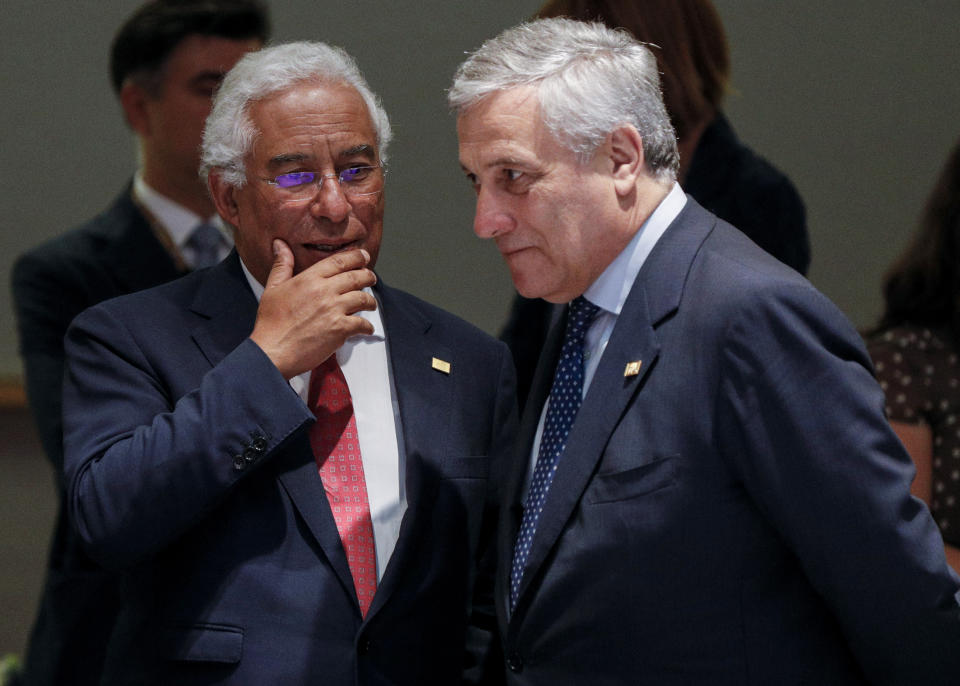European Parliament President Antonio Tajani, right, speaks with Portuguese Prime Minister Antonio Costa during a round table meeting at an EU summit in Brussels, Sunday, June 30, 2019. European Union leaders have started another marathon session of talks desperately seeking a breakthrough in a diplomatic fight over who should be picked for a half dozen of jobs at the top of EU institutions. (Geoffroy Van Der Hasselt, Pool Photo via AP)